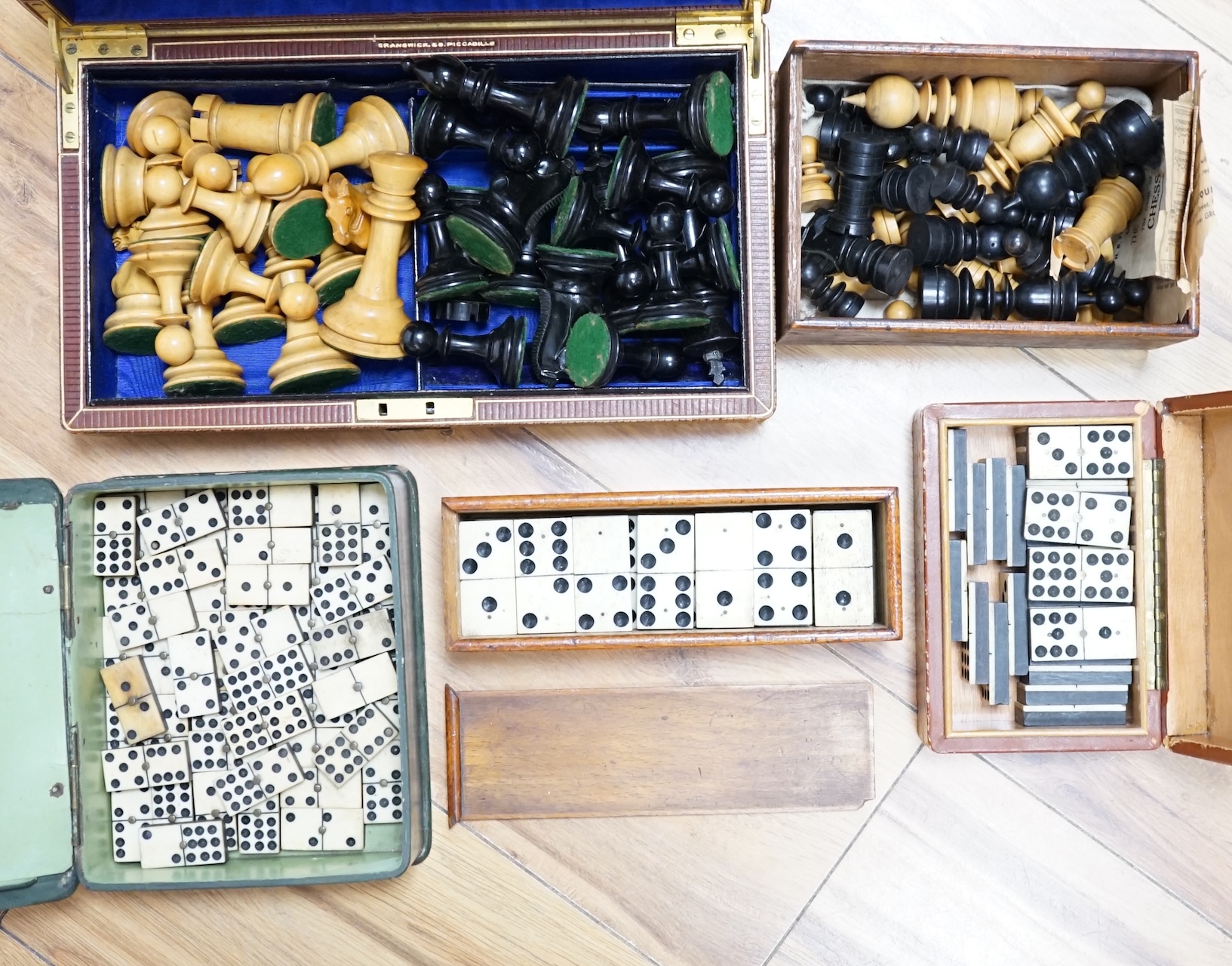 Three sets of dominoes and two chess sets, one Staunton pattern
